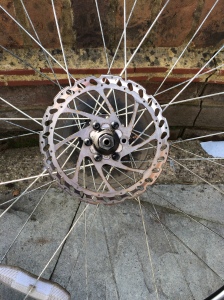 Picture of a very dirty bicycle rotor